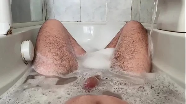 Show 24 year old in the bathtub playing with her feet and cock my Movies